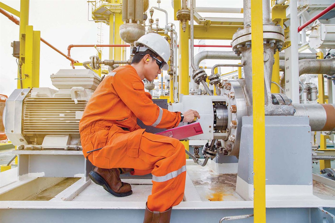 Technician inspecting rotating equipment